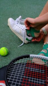 Tennis Shoes on a Clay Court